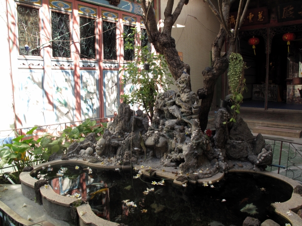 A small ornamental pond in a side court.