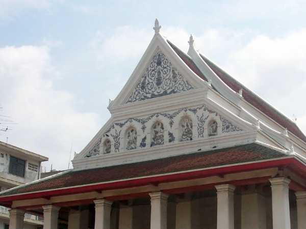 The white-and-blue decorations on the gable of a chapel